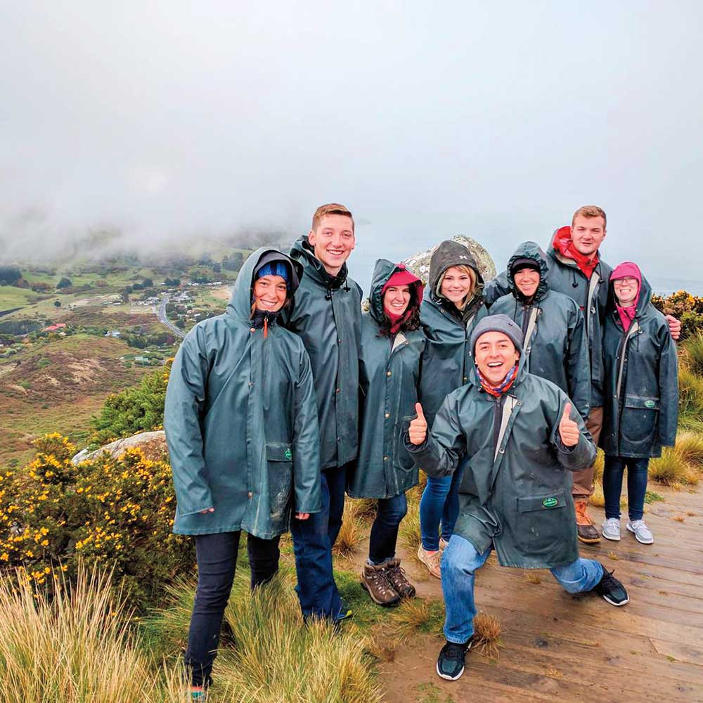 Mother and daughter leaning on kitchen counter